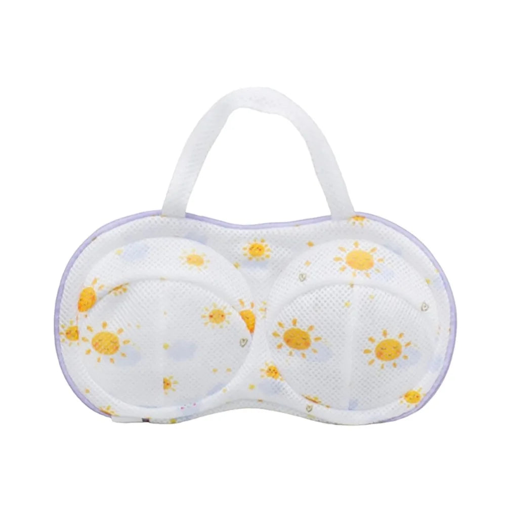 White reusable zippered laundry bag with a purple trim and a sun pattern.