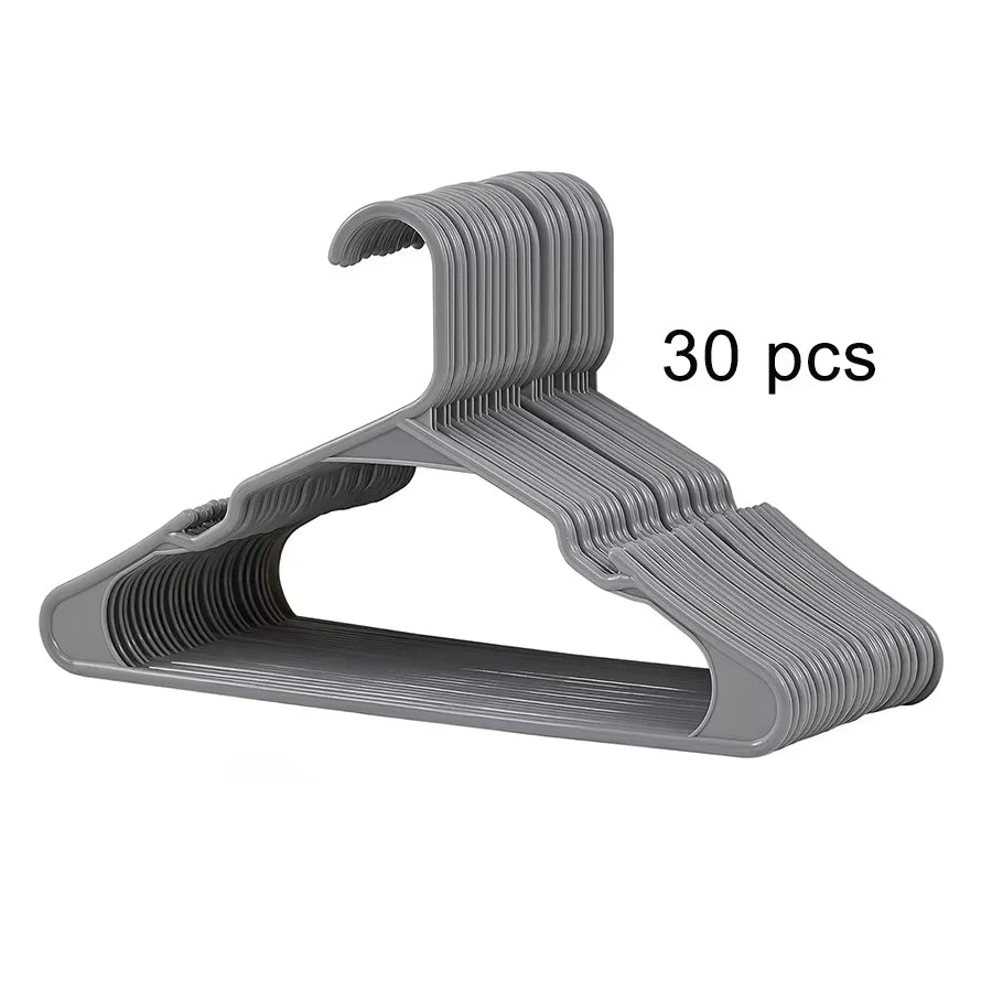 A set of thirty gray plastic clothes hangers designed for eco-friendly use.