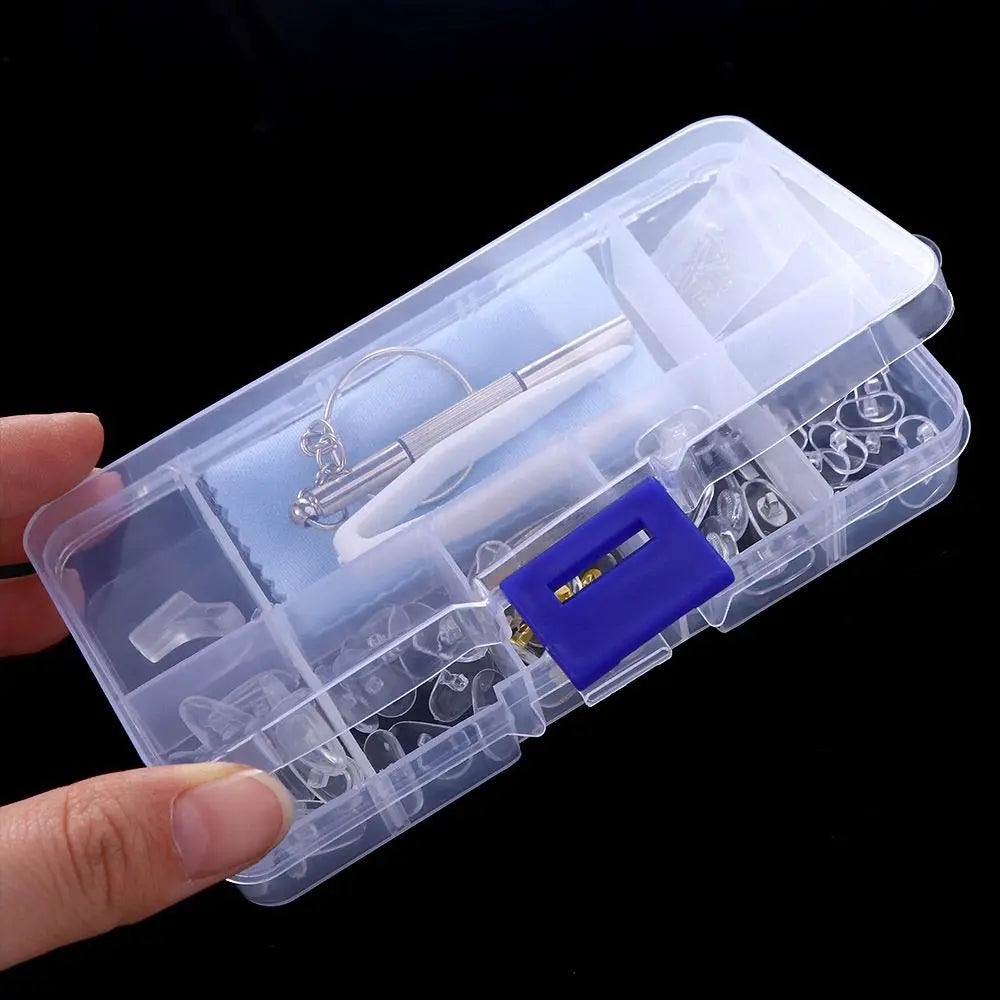 A clear plastic case containing a precision glasses repair kit with a screwdriver and various small tools.