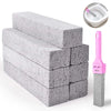 A stack of gray pumice cleaning scrubbers with a pink handle and a small bowl for cleaning.