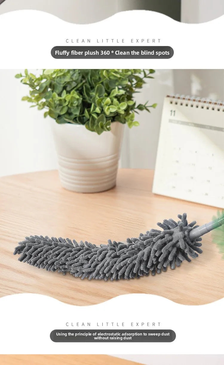 A gray fluffy fiber dust duster is shown next to a potted plant on a wooden surface.