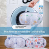 A white washing machine drum holds a mesh laundry bag for bra and lingerie protection.