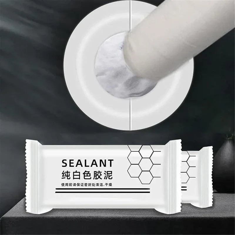 White sealant clay tube being applied to a white circular surface for sealing