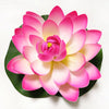 A vibrant pink artificial lotus flower with yellow accents displayed on a green leaf.