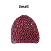 A small, dark magenta hand-crocheted mesh hair net cap.