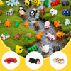 A collection of 50 mini 3D printed animal figurines in various colors and species arranged on green moss.