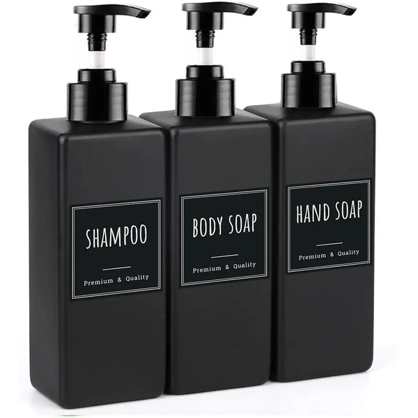 A set of three black hand soap dispensers with pump tops, labeled for shampoo, body soap, and hand soap.