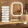 A white LED desktop vanity mirror with an oval light frame is displayed on a countertop.