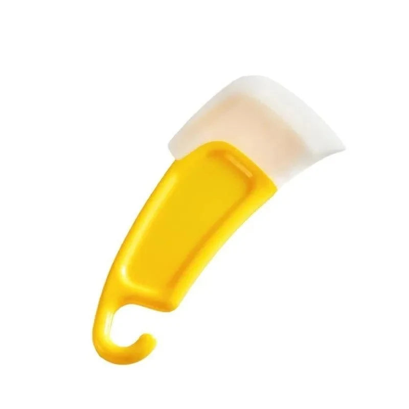 A yellow silicone kitchen scraper tool with a white rubber blade, shown diagonally.