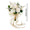 Elegant artificial rose wedding bouquet featuring white roses and greenery tied with a sheer ribbon