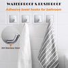 Adhesive towel hooks made of stainless steel mounted on a white tile wall.