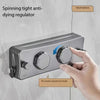 A hand adjusts the tightness of a spinning tight anti-dying regulator device mounted on a wall.