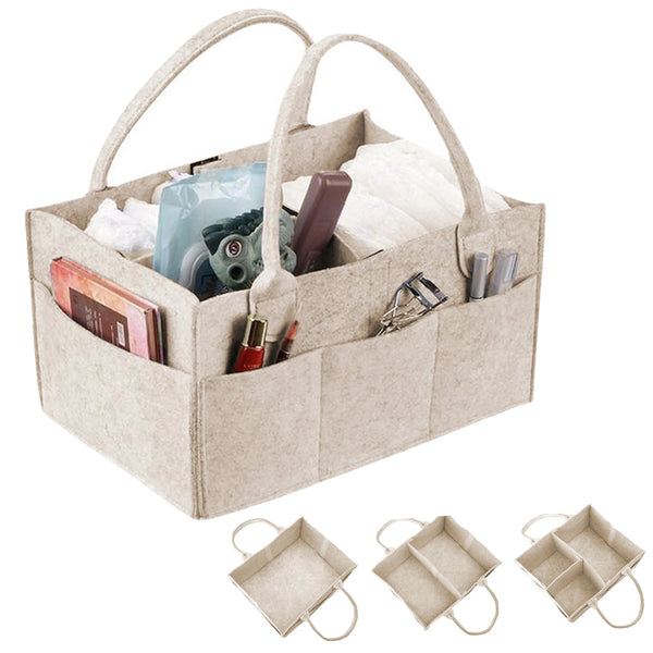 A beige felt diaper organizer caddy with handles filled with baby essentials like wipes and toiletries.