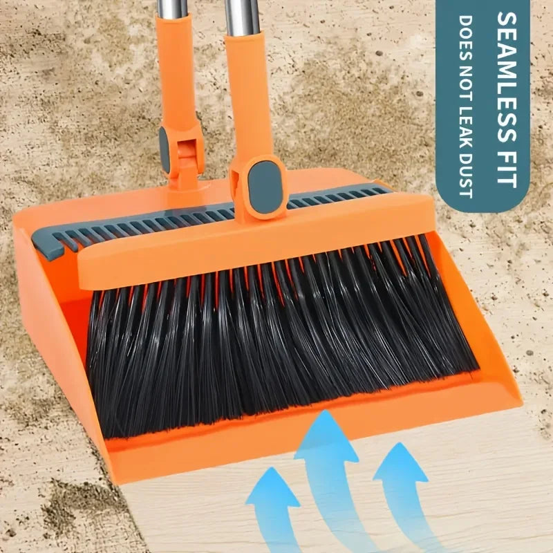 Orange broom with black bristles and a dustpan, designed for seamless fit and effortless pet hair removal.