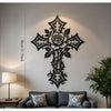 Black metal cross wall art decor with rose and leaf design mounted on a light gray wall.