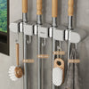 Wall mounted broom holder with multiple hooks for kitchen and bathroom cleaning tools