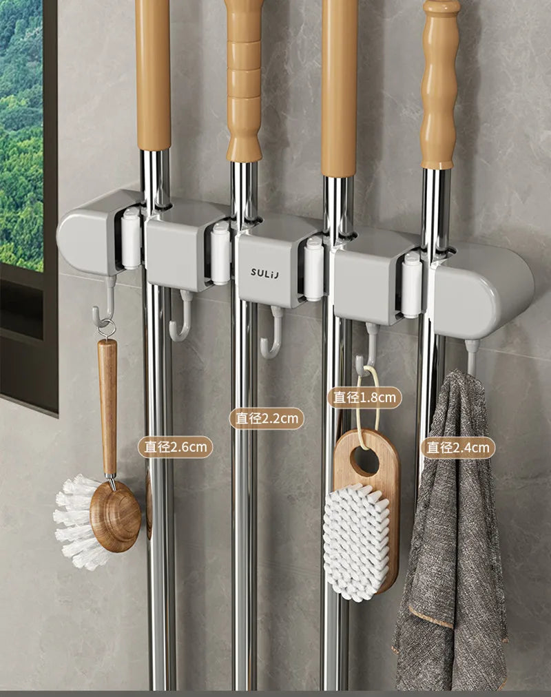 Wall mounted broom holder with multiple hooks for kitchen and bathroom cleaning tools