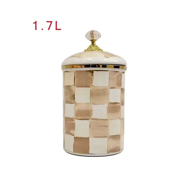 A square enamel storage jar with a lid featuring a gold accent and a beige and white checkered pattern.