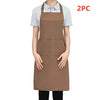 A person is wearing a brown chef apron over a light gray shirt, with a separate piece visible. 2 pieces included.