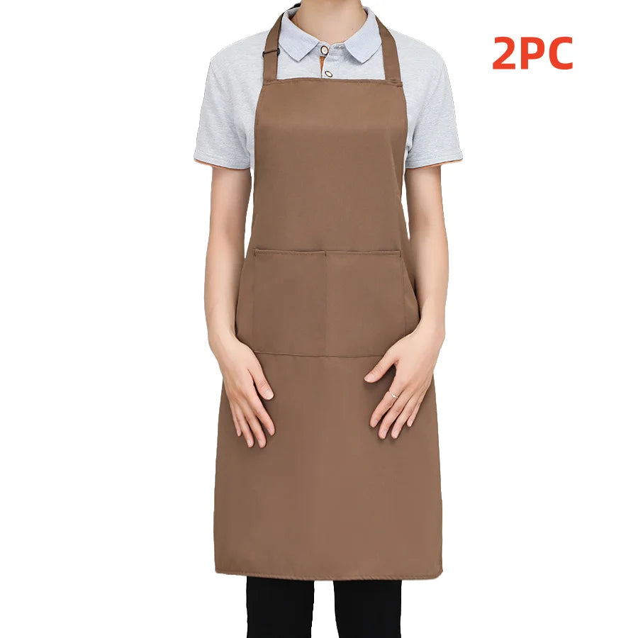 A person is wearing a brown chef apron over a light gray shirt, with a separate piece visible. 2 pieces included.