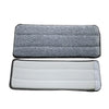Two reusable microfiber mop pad refills, one gray and one white.