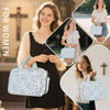 A woman holds a light blue floral quilted Bible cover bag with study accessories.
