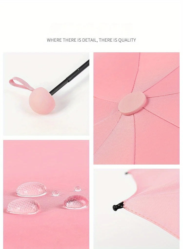 Pink folding UV protection umbrella with a pink fabric detail and black handle.
