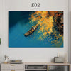 An oil painting depicting a yellow boat sailing on blue water with vibrant autumn foliage.