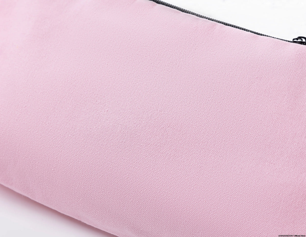 A close-up of a pink zippered bag used for storing cosmetics or stationery.