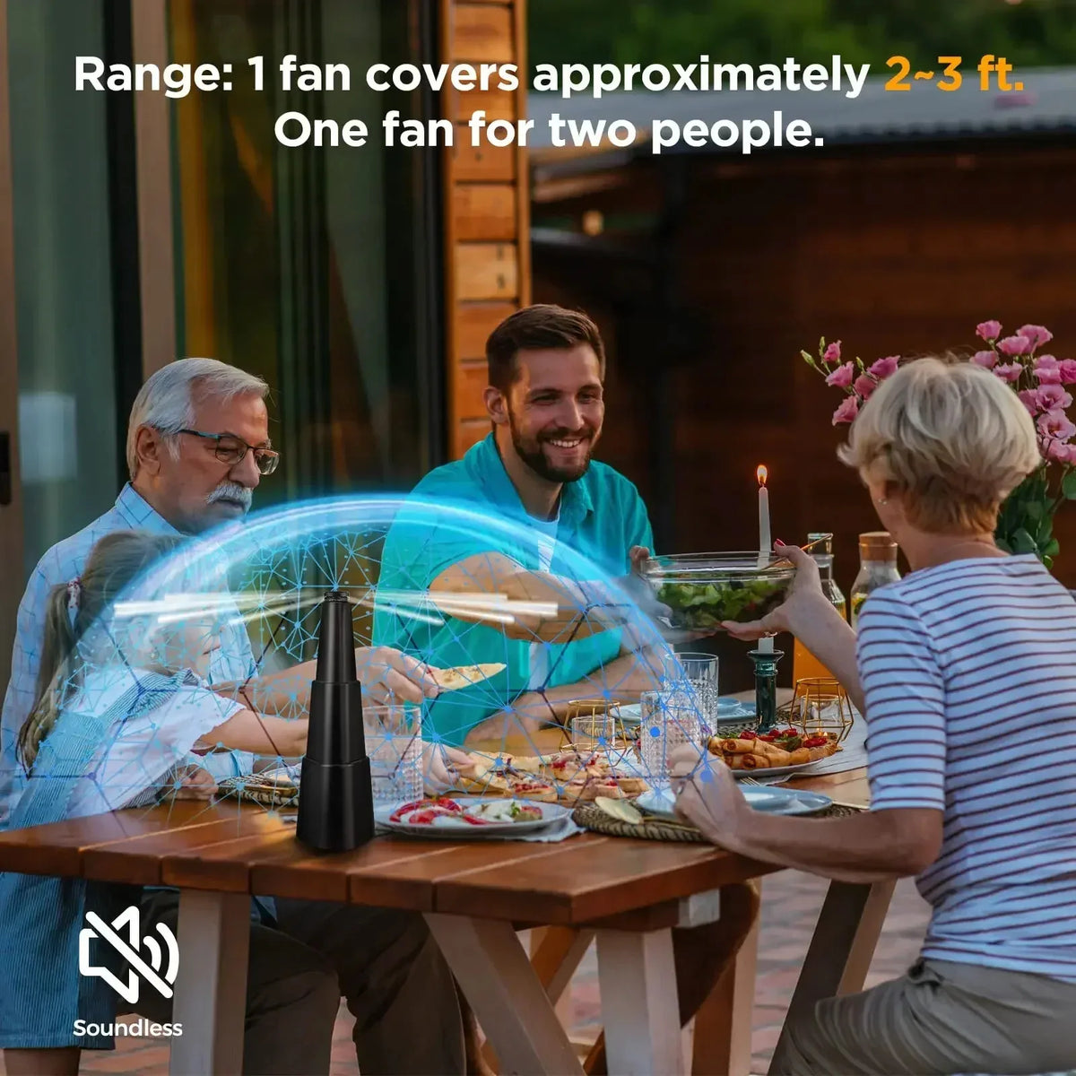 Three people enjoying a meal outdoors while using a multi-functional fly repellent fan.