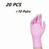 A hand wearing a light pink disposable nitrile glove is shown against a white background.