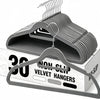 A set of thirty non-slip velvet hangers with chrome hooks displayed on a cardboard box.