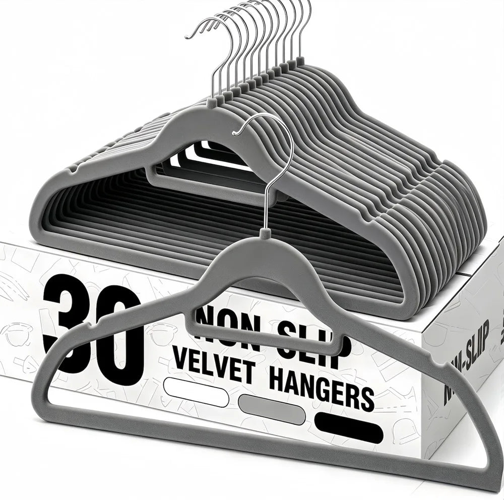 A set of thirty non-slip velvet hangers with chrome hooks displayed on a cardboard box.