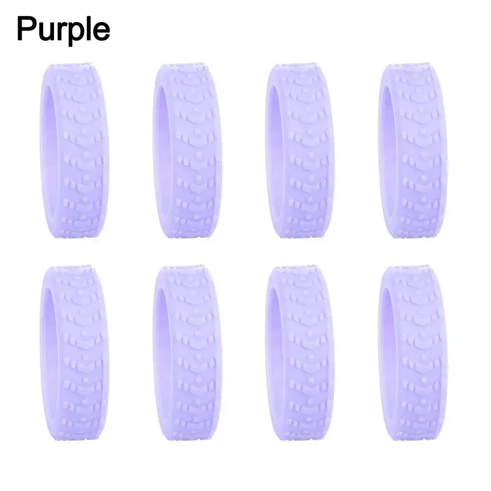 Purple silicone luggage wheel protectors in an 8-pack.