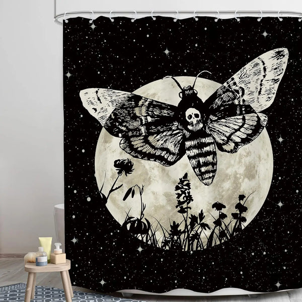 A black shower curtain featuring a large moon with a skull and butterfly motif against a starry background.