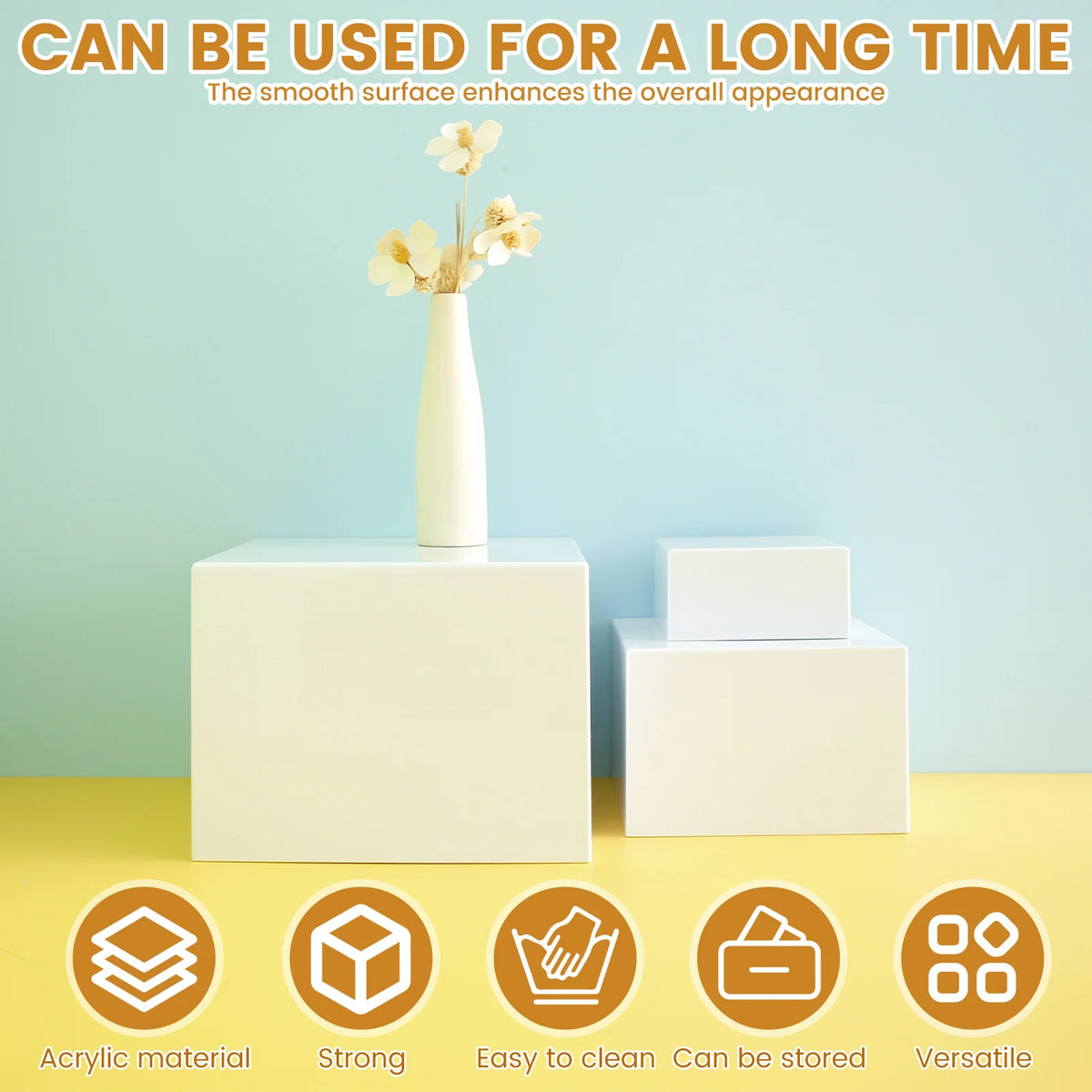 White acrylic stackable riser used for food display with a vase of flowers.