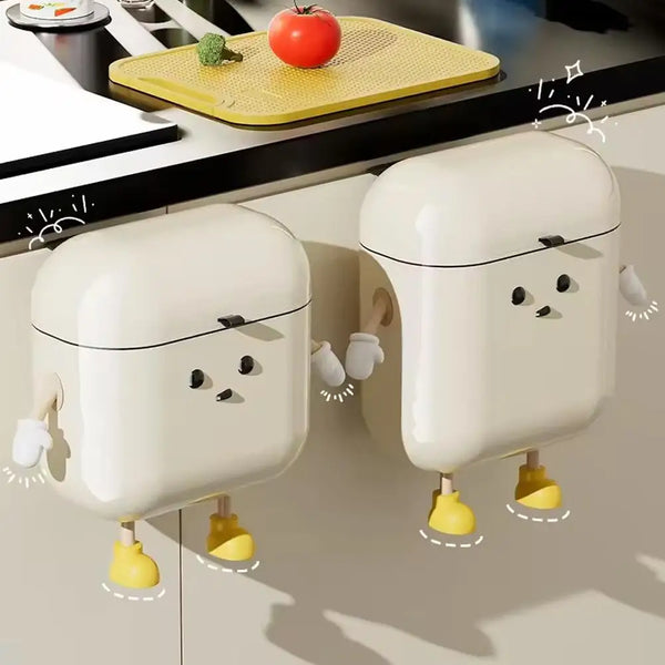 A white cartoon-themed hanging trash can with a lid is shown against a light background.