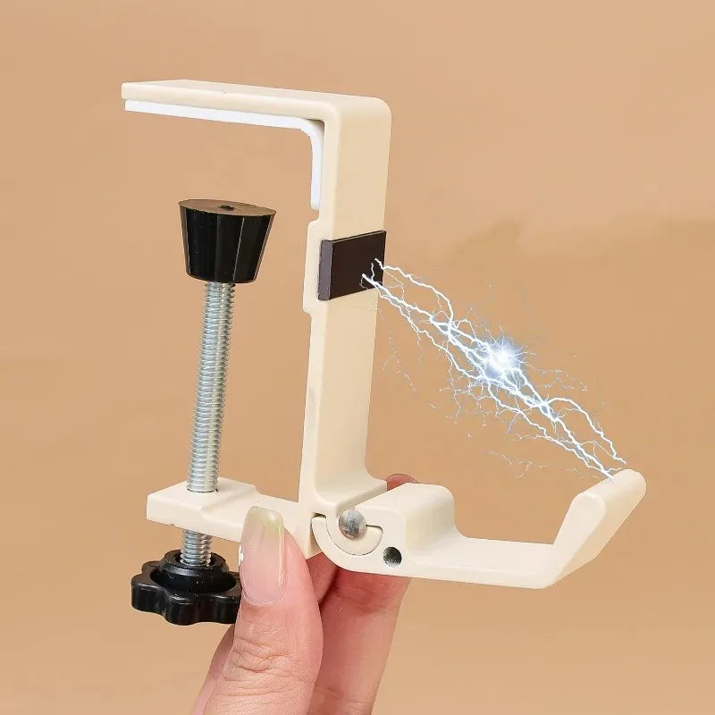 A hand holds an adjustable desk hook hanger device that emits a small electrical spark.