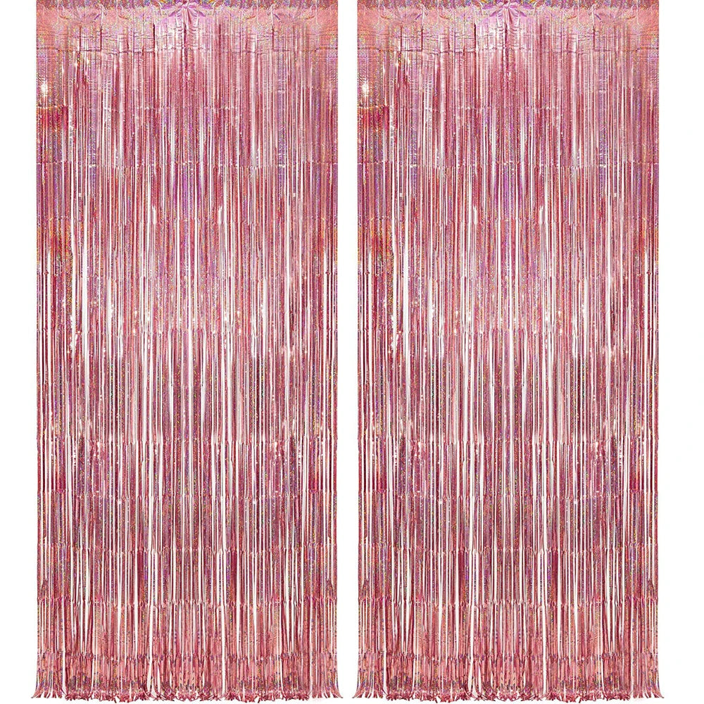 A vertical backdrop featuring shimmering rose gold foil tinsel fringe curtains.