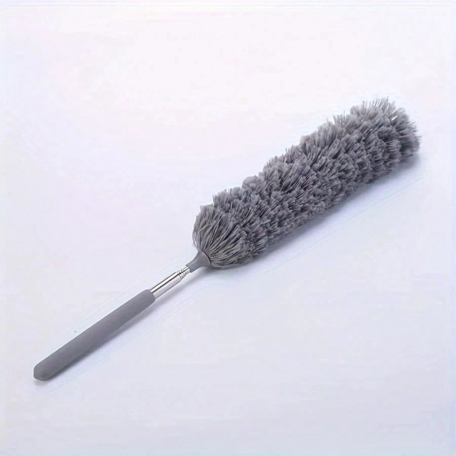 A gray flexible microfiber cleaning duster brush with a handle and dense bristles.