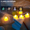 A set of yellow LED tea lights with artificial rose petals are displayed on a wooden surface.