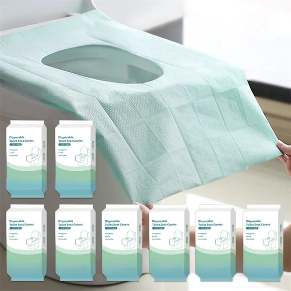 A light mint green disposable oversized toilet seat cover is shown folded on a surface.