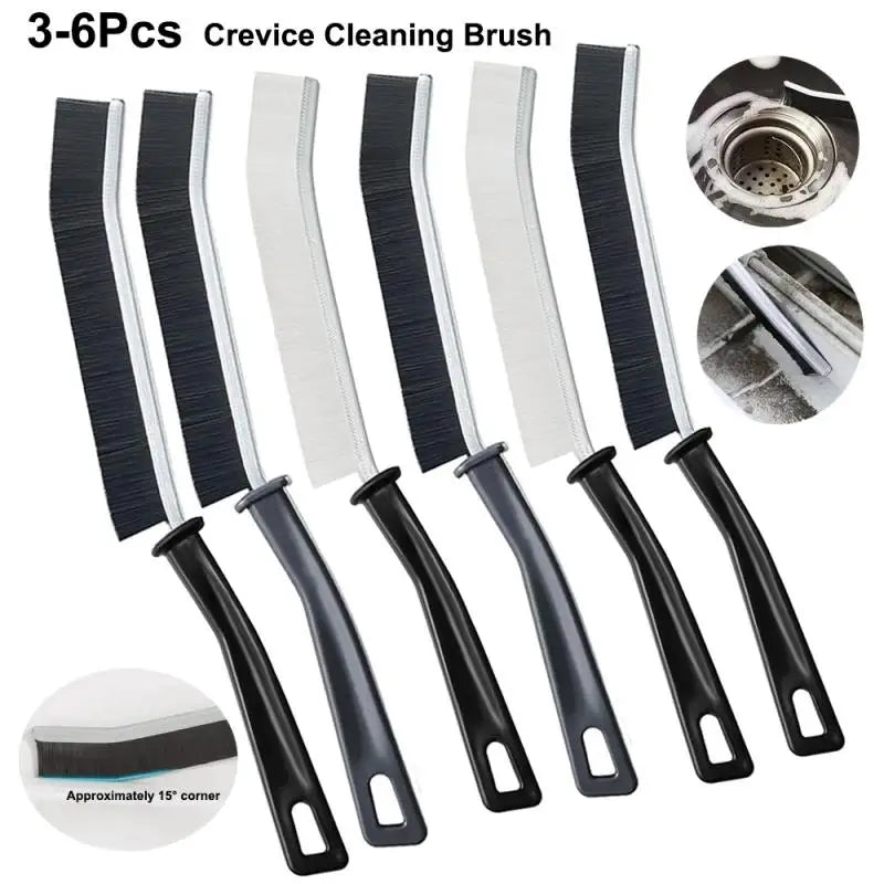 A set of six black and white crevice cleaning brushes for tight spaces, including a cleaning head.