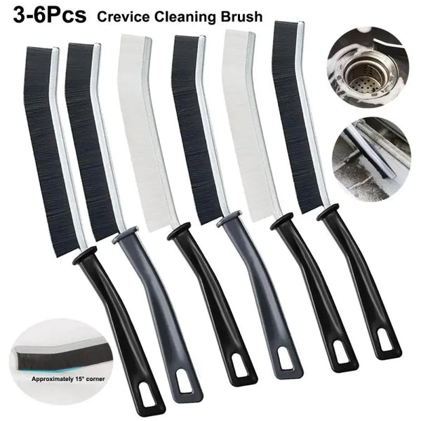 A set of six black and white crevice cleaning brushes for tight spaces, including a cleaning head.