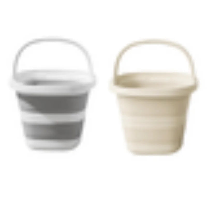 A pair of collapsible water buckets with handles, one gray and white, the other beige and white.