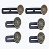 A set of adjustable button extenders for clothing in dark gray metal.