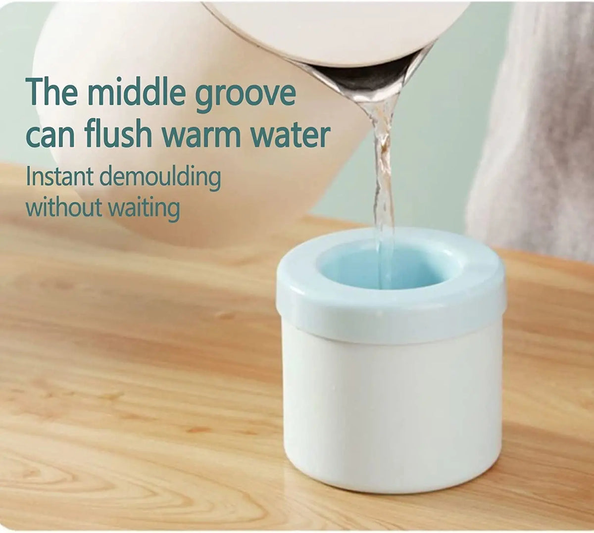 A white silicone ice cube mold is shown with warm water being flushed through the middle groove.