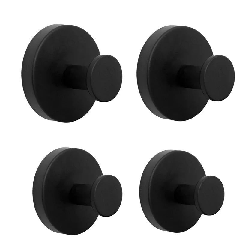 A set of four black stainless steel suction cup towel racks shown from different angles.
