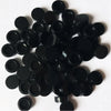 A pile of round black building blocks for DIY projects.