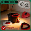 A red and black microfiber spin mop is shown with a white mop head and a refill head on a tiled floor.